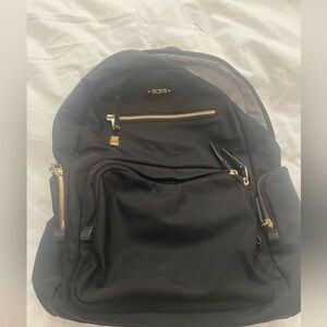 Tumi Women’s Black Backpack with Gold Accents